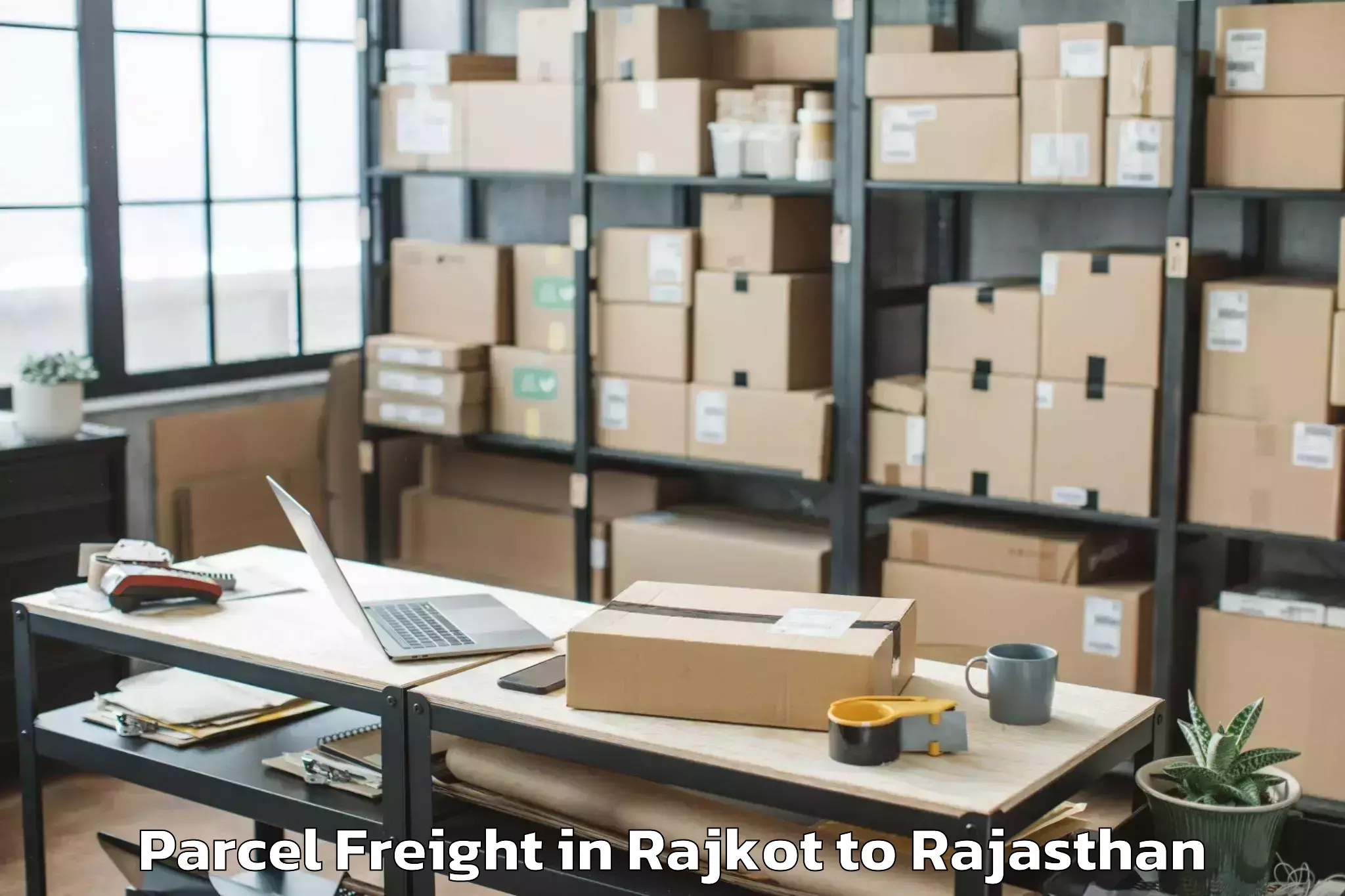 Professional Rajkot to Jodhpur National University Jo Parcel Freight